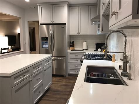 steel gray counter white cabinet|white quartz countertops gray cabinets.